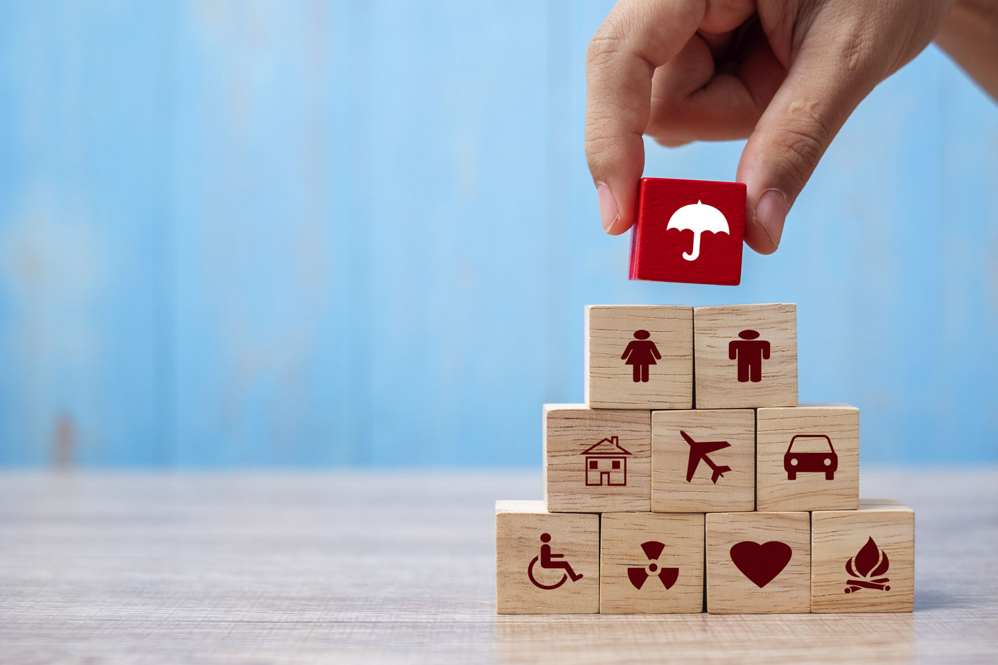 Hand holding umbrella wood block cover Insurance icon. healthcar Hand holding umbrella wood block cover Insurance icon. healthcar