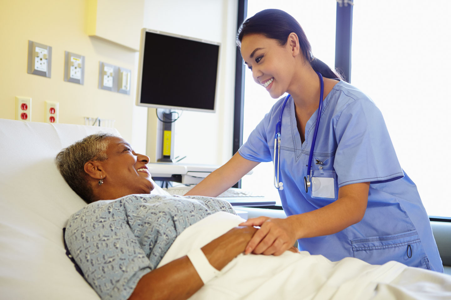Nurse Talking To Senior Woman In Hospital Room Additional Coverage Nurse Talking To Senior Woman In Hospital Room